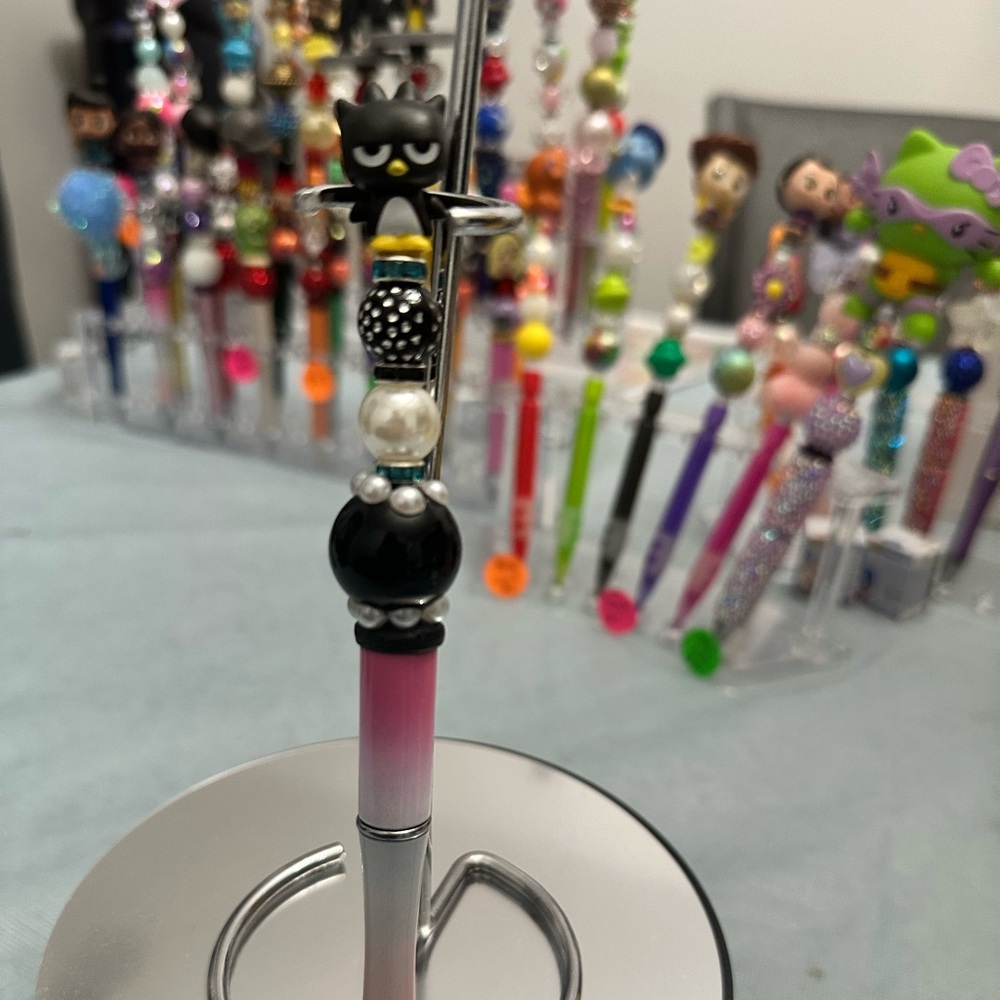 Black and Pink Character Pen